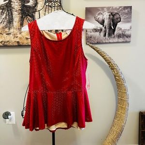 Faux leather sleeve-less top. Couture Peplum top